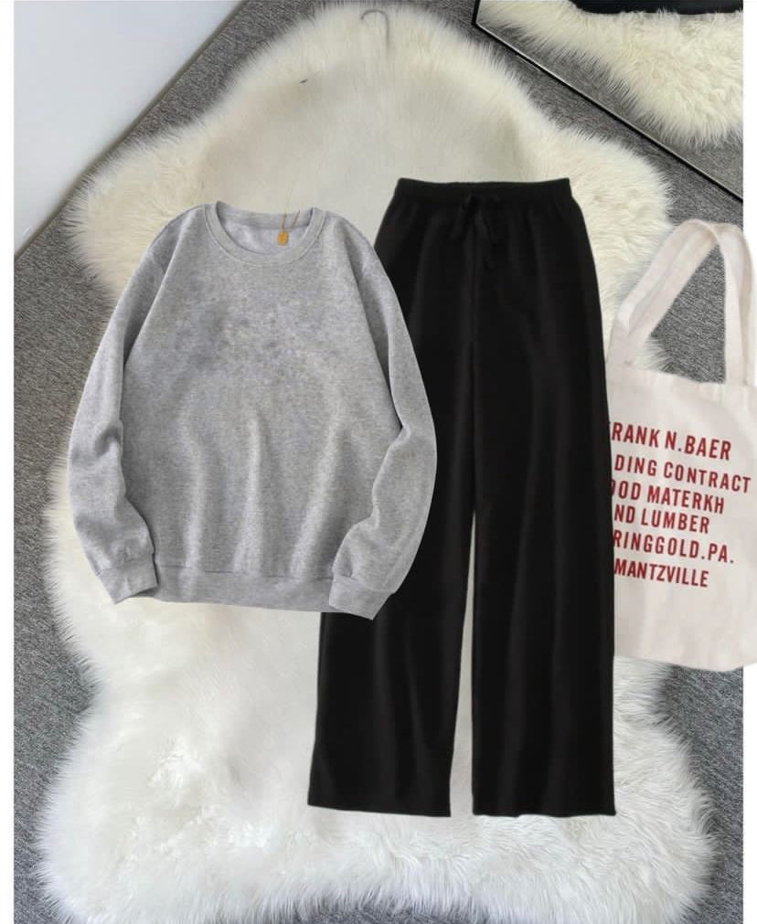 Grey sweatshirt and black flapper (track suit)